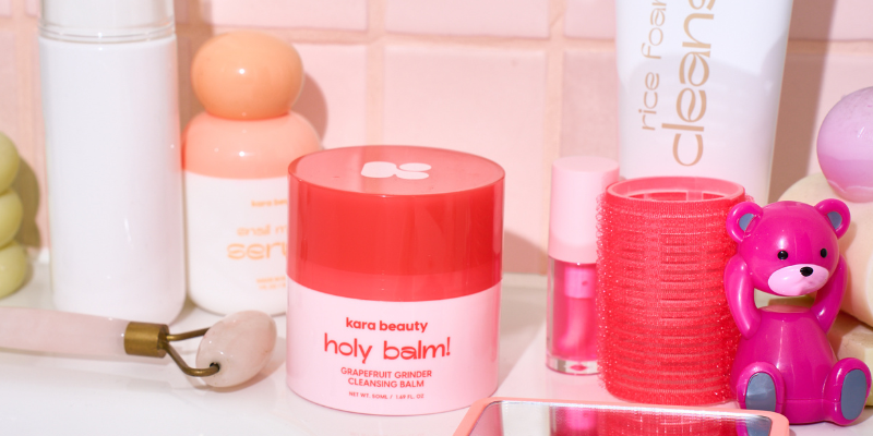 Holy Balm! Grapefruit Grinder Cleansing Balm sitting on bathroom counter along with other Kara Beauty skincare products.