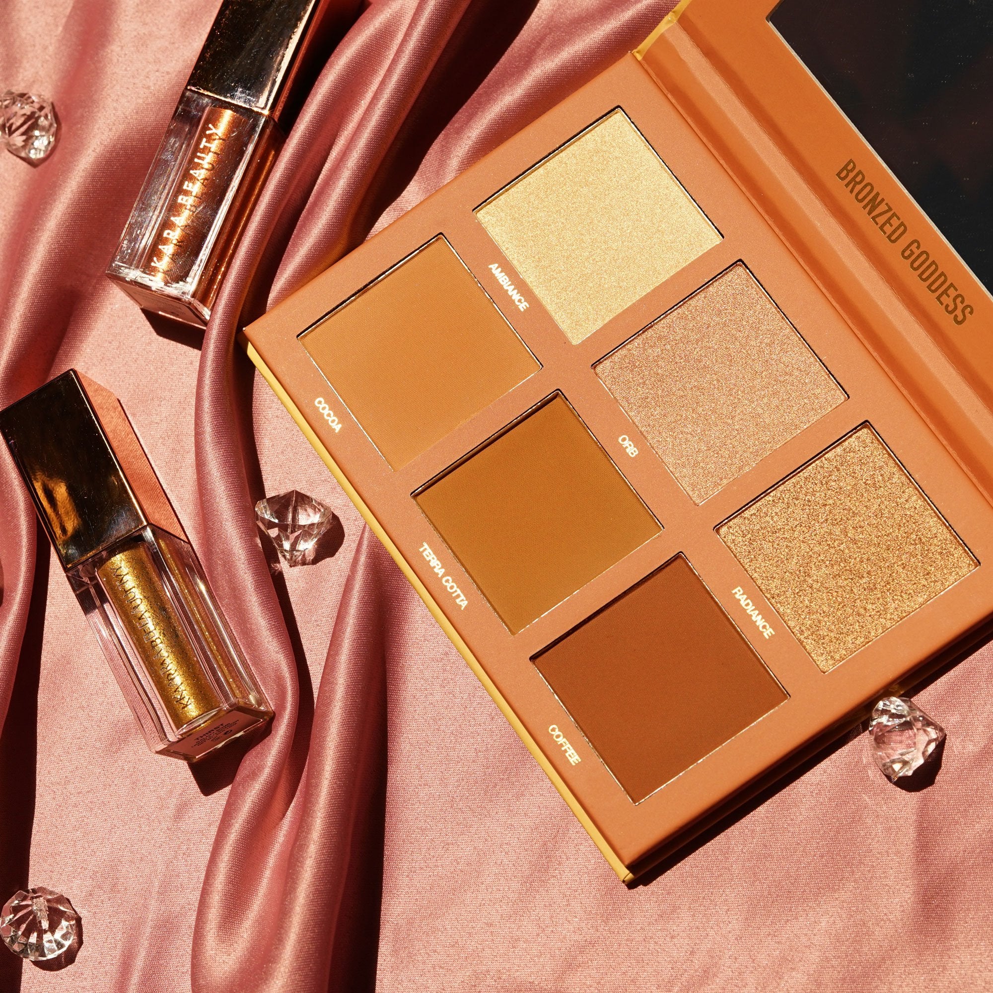 Kara Beauty's Bronzed Goddess Highlighter and Bronzer palette instagram picture with props