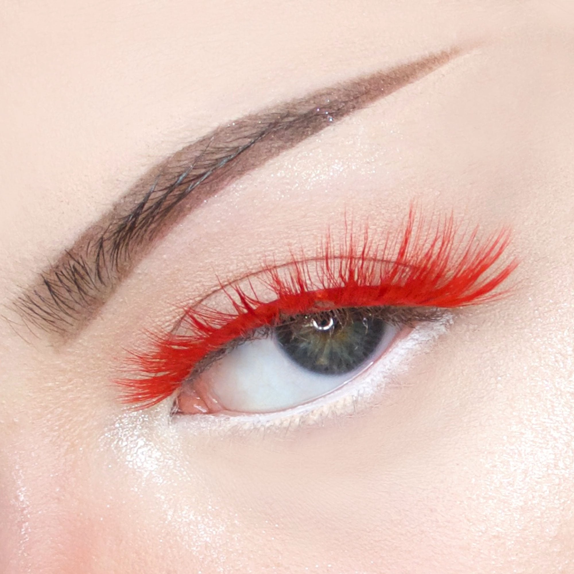 Red color 3D faux mink eyelashes on blue eyed model